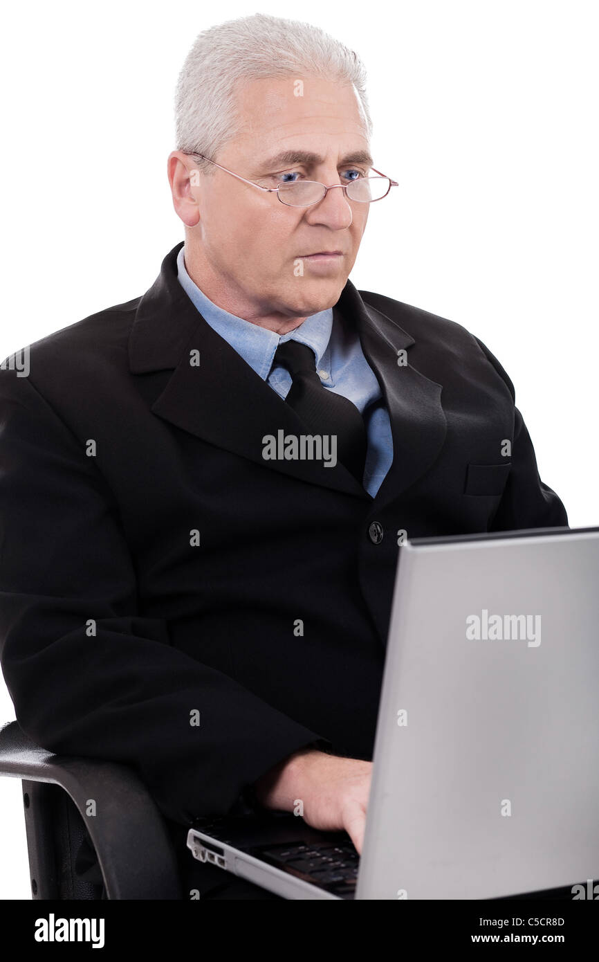Mature business man busy working in notebook on white background Stock Photo