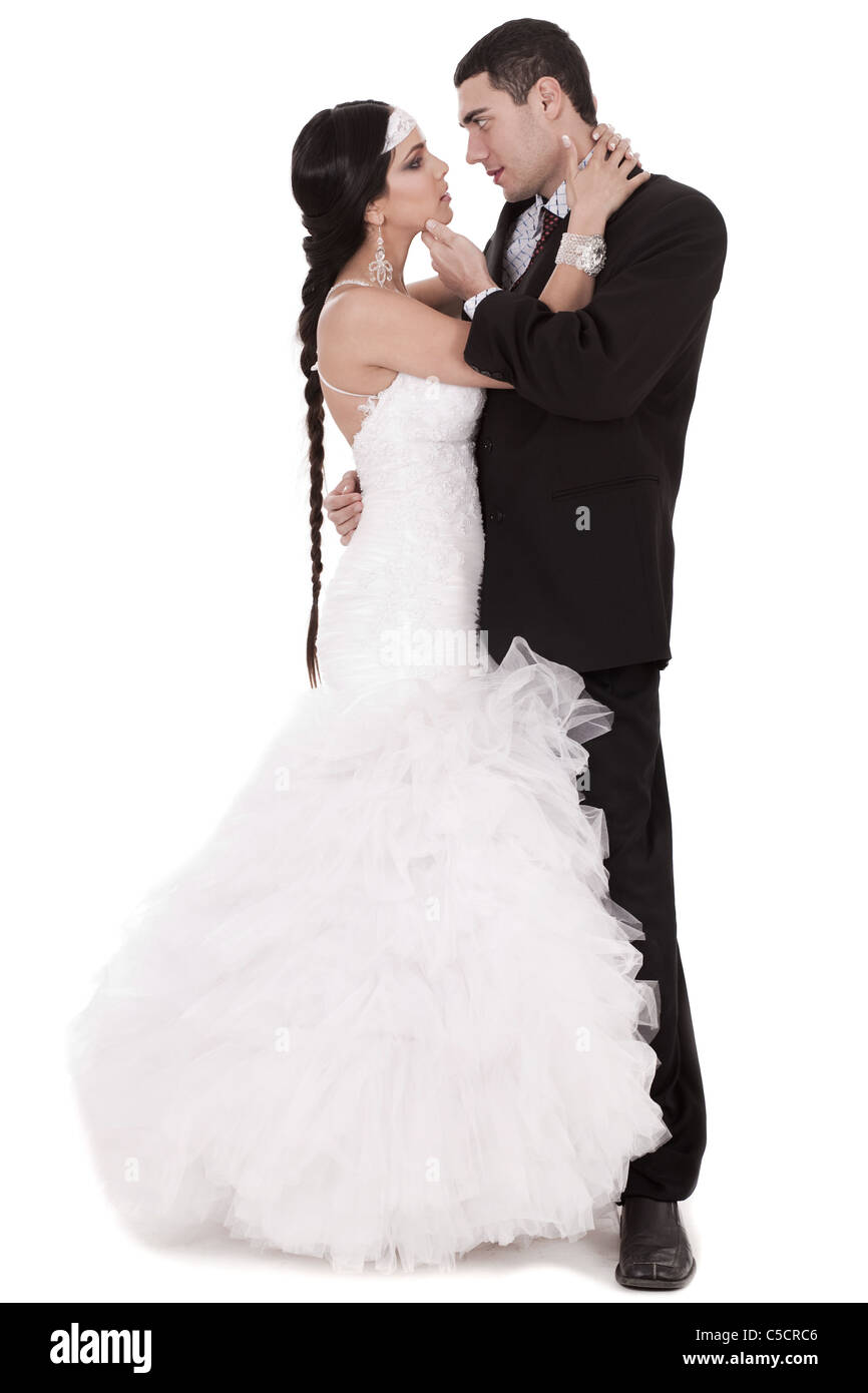 Newly married couple loving each other over white background Stock Photo