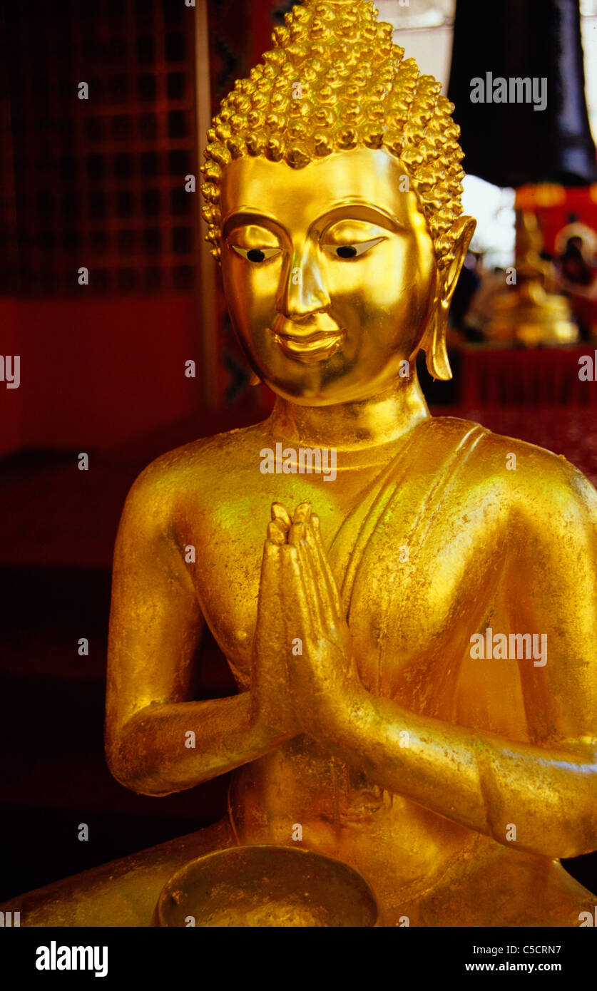 gold statue of a buddha figure in Singapore Stock Photo Alamy