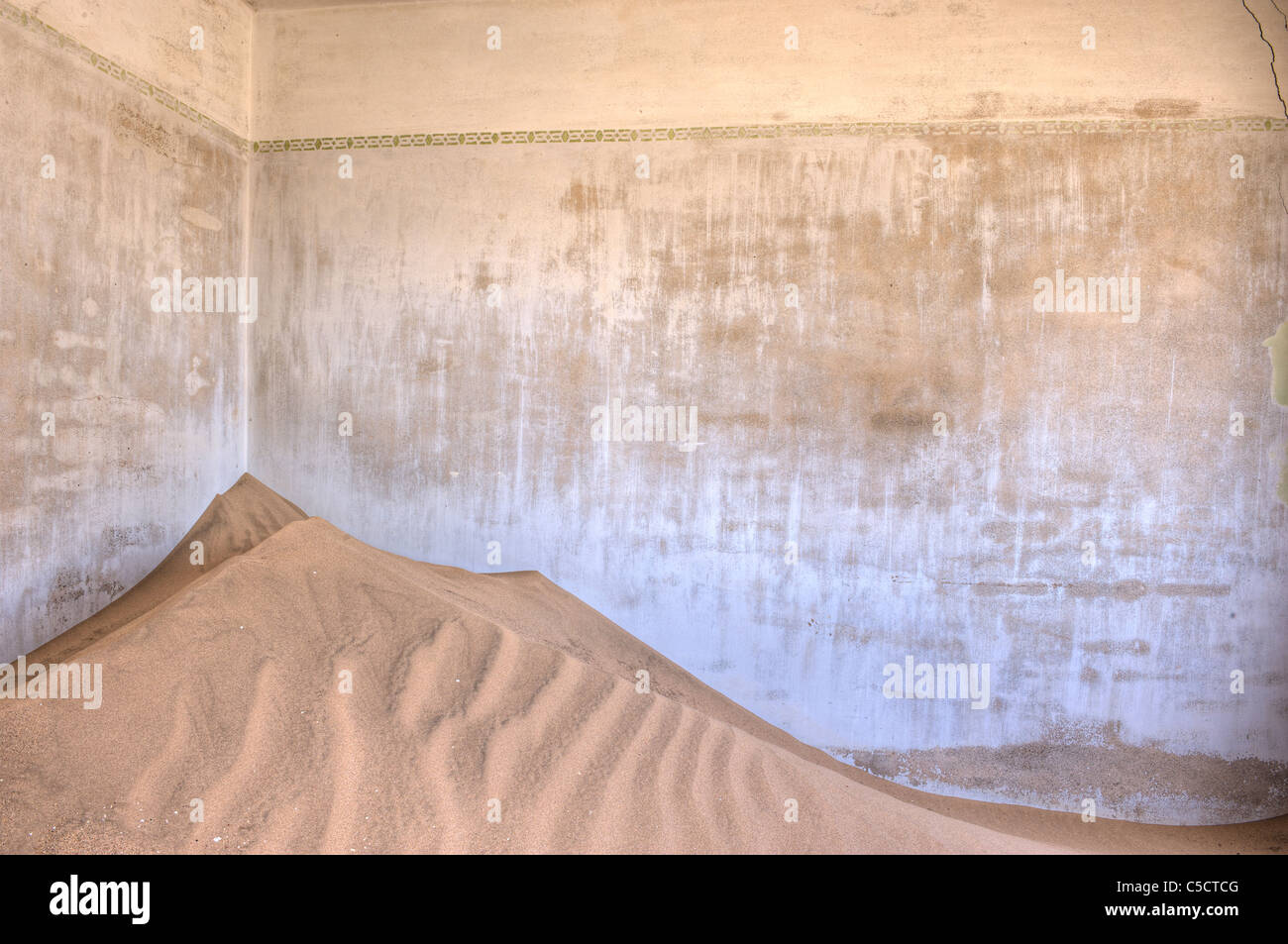 Blue wall in sand-filled building, Kolmanskop Ghost Town near Luderitz, Namibia, Africa. Stock Photo