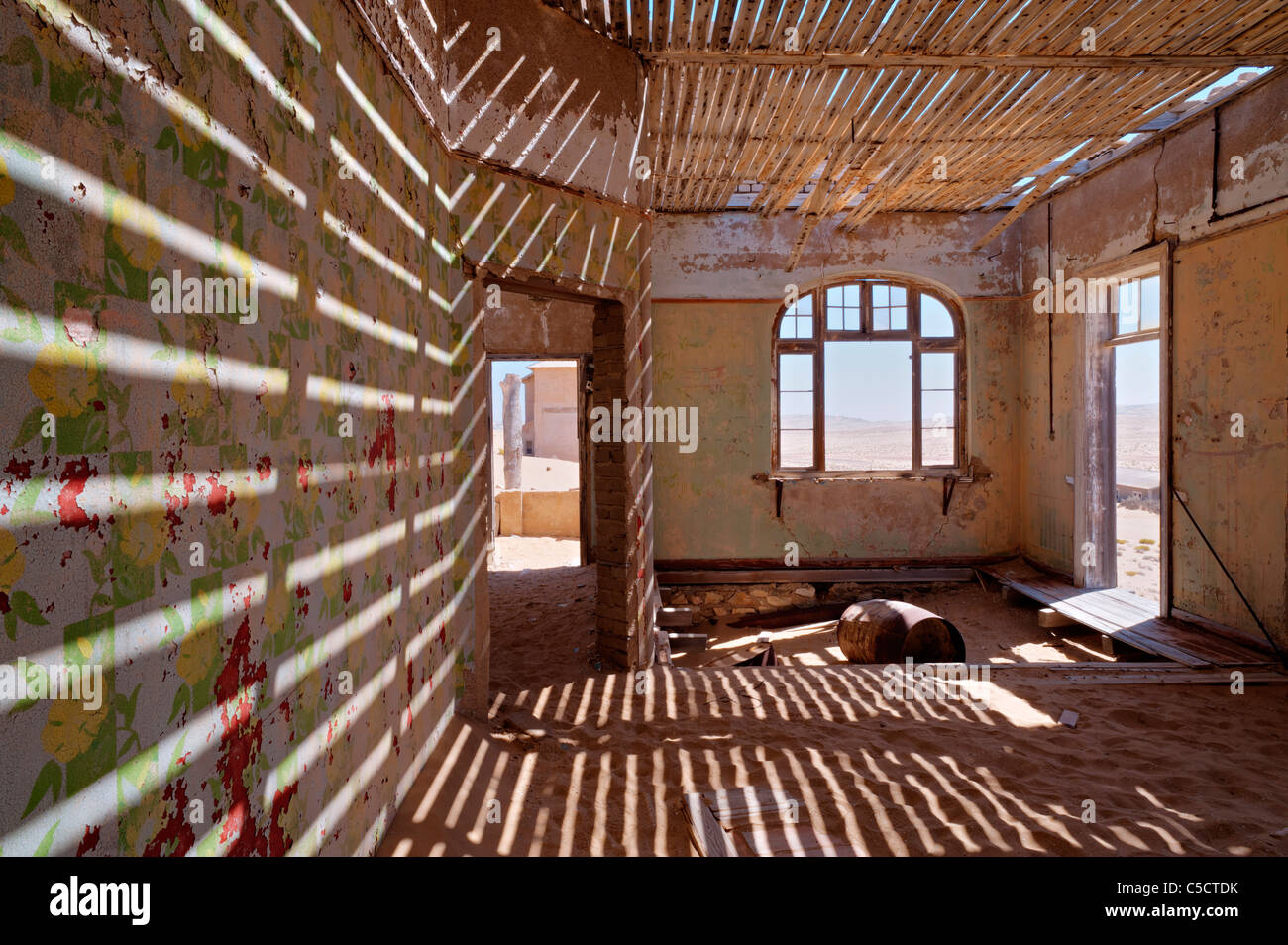 Sun shadows in building without roof, Kolmanskop Ghost Town near Luderitz, Namibia, Africa. Stock Photo