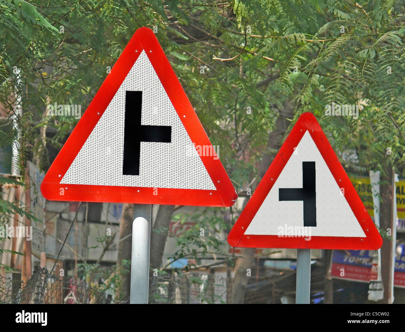 Road signboards showing side roads ahead to right and left Stock Photo -  Alamy