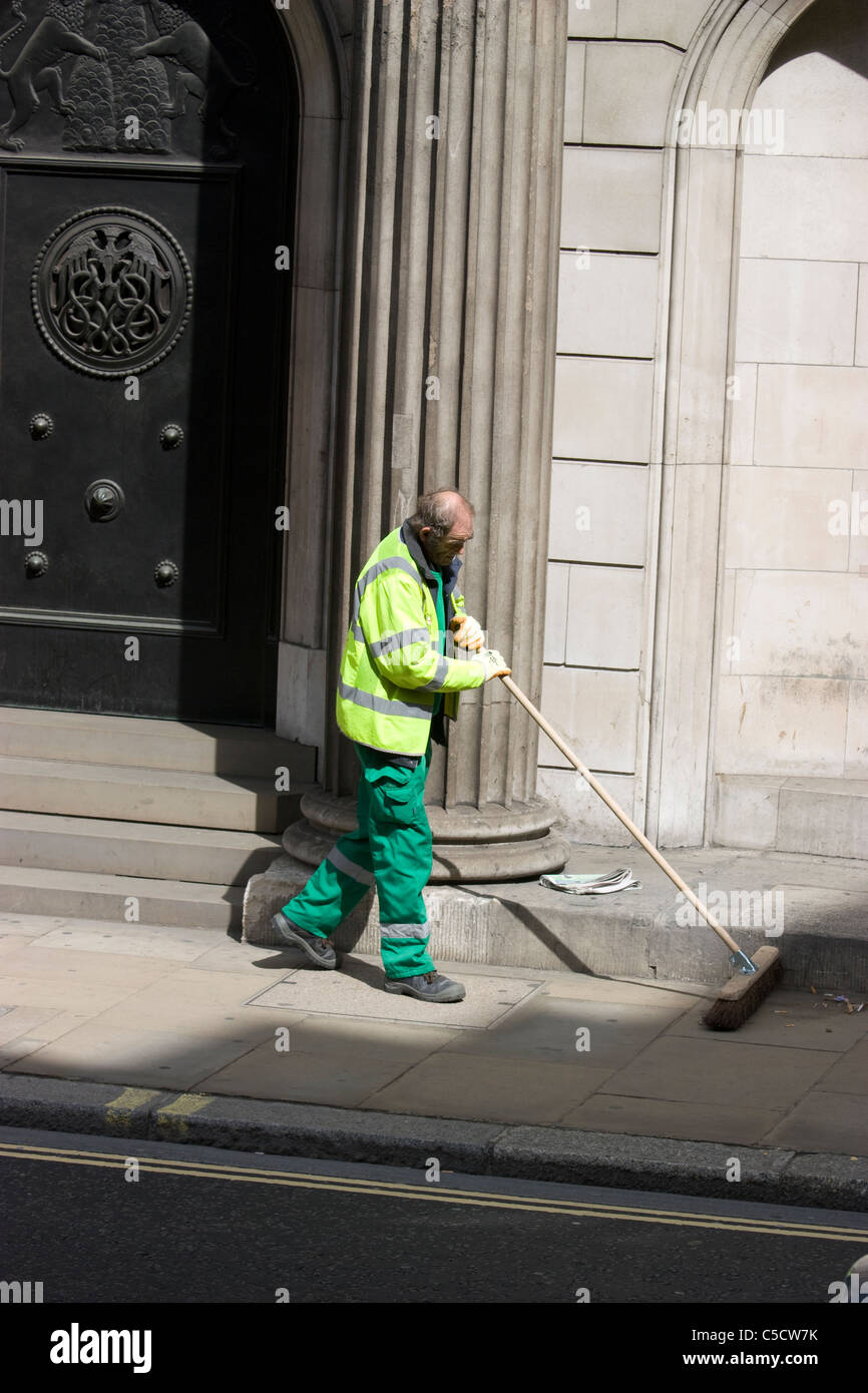 street sweeper cleaning outside the bank of england Threadneedle street