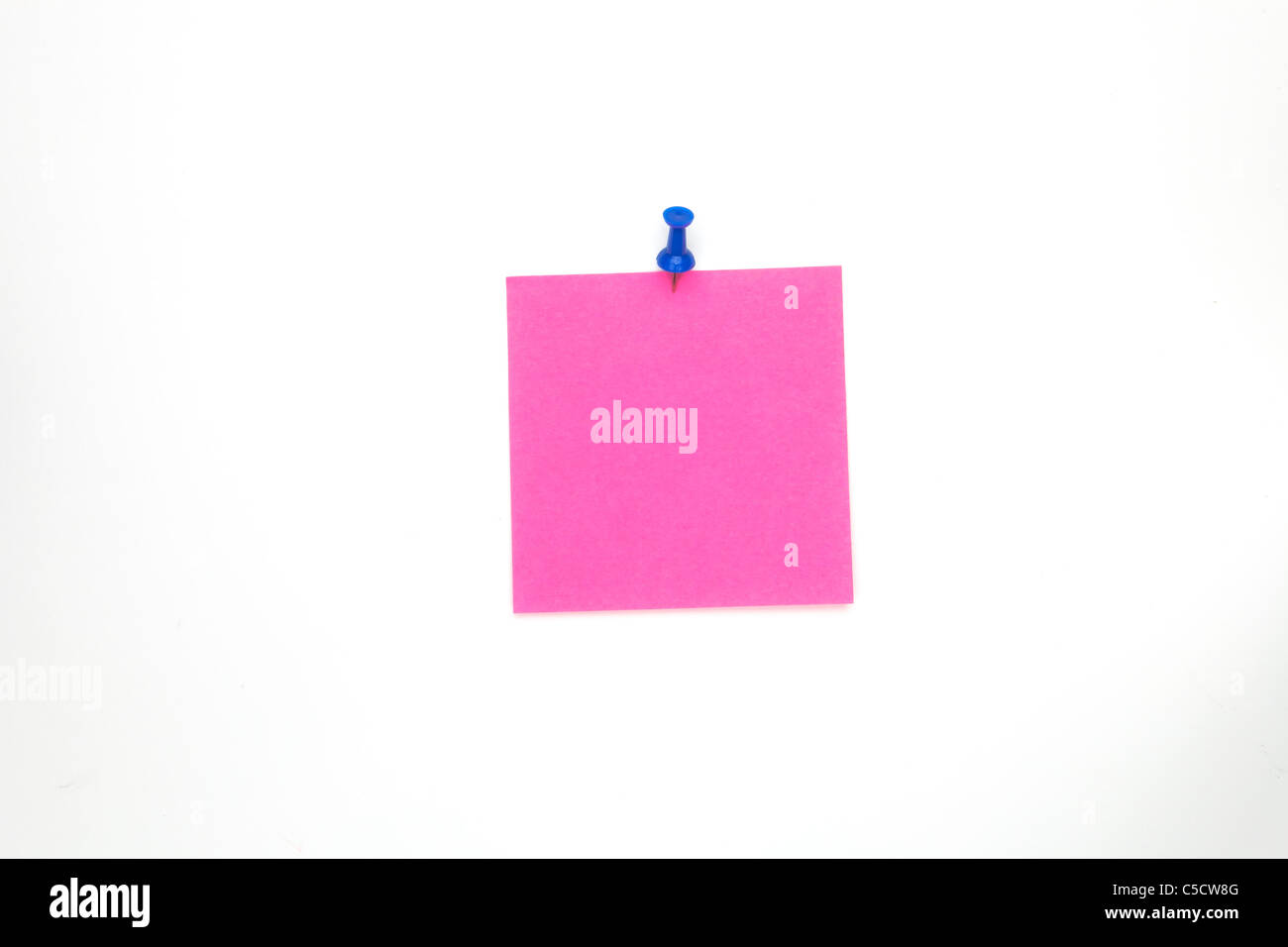 a pink note paper with a blue steel pin Stock Photo