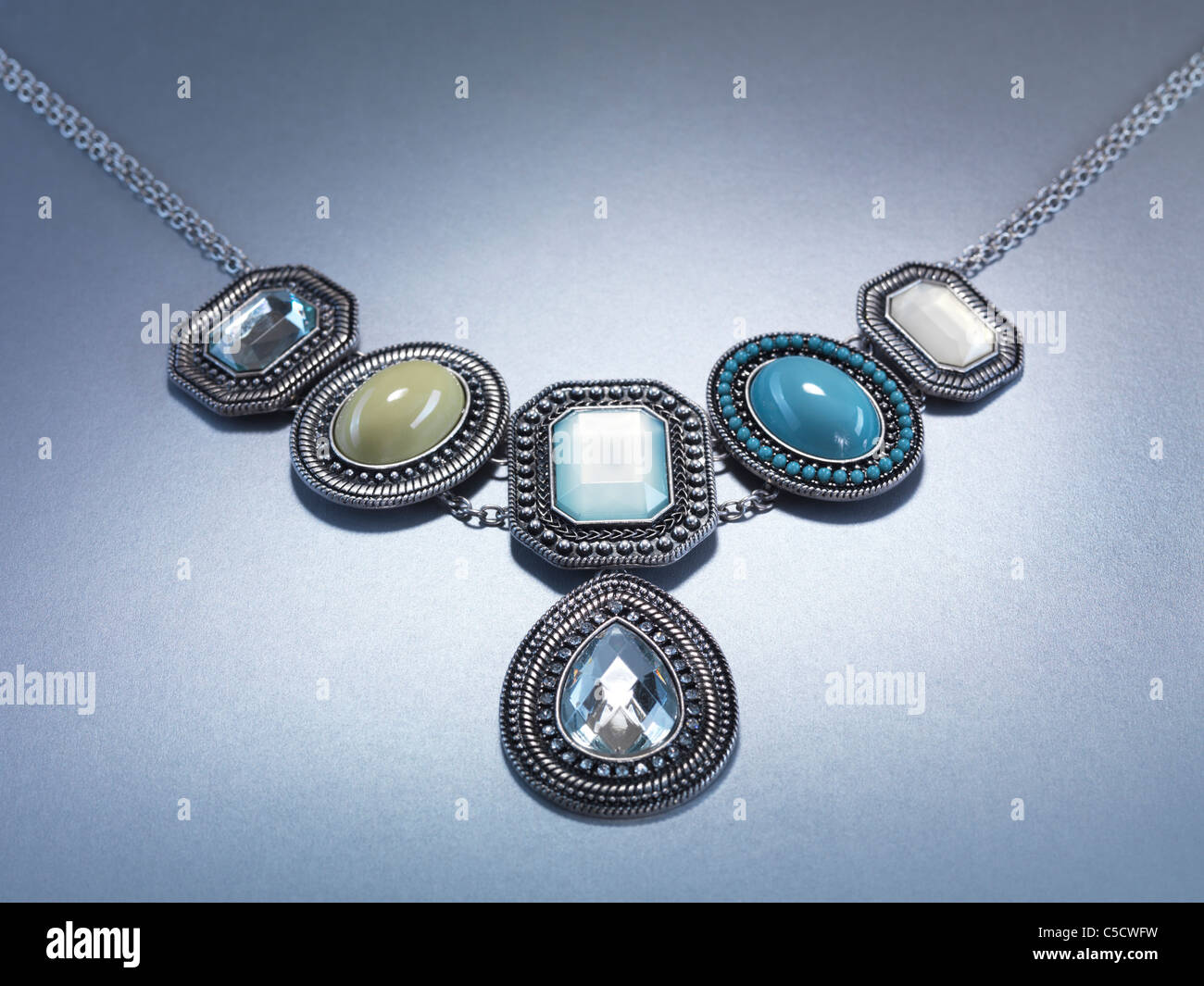 Pendant necklace jewellery isolated on gray background Stock Photo