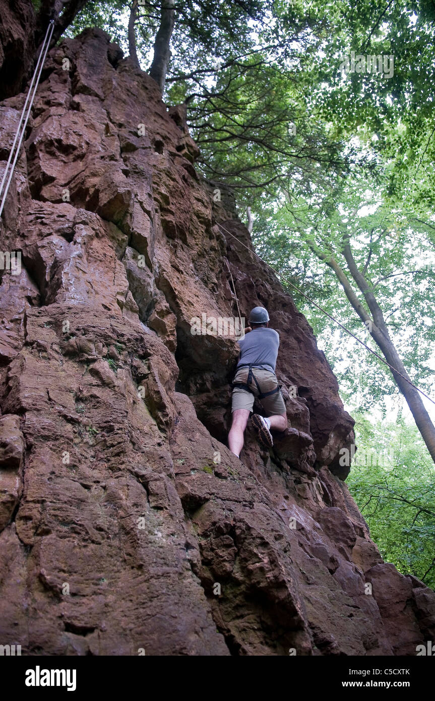 Rock climbing with ropes at Symonds Yat, Forest of Dean, Gloucestershire, UK Stock Photo
