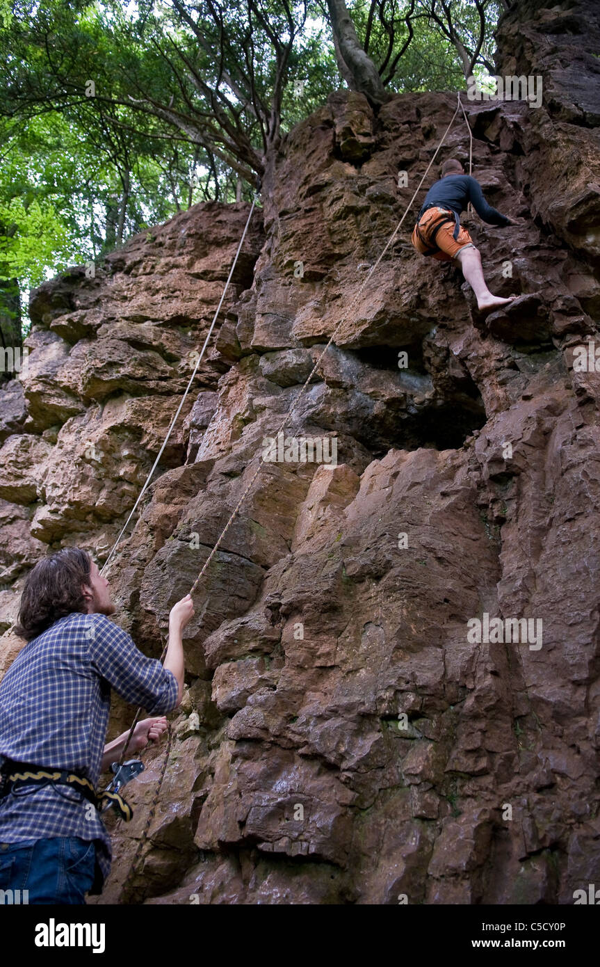 Rock climbing with ropes at Symonds Yat, Forest of Dean, Gloucestershire, UK Stock Photo