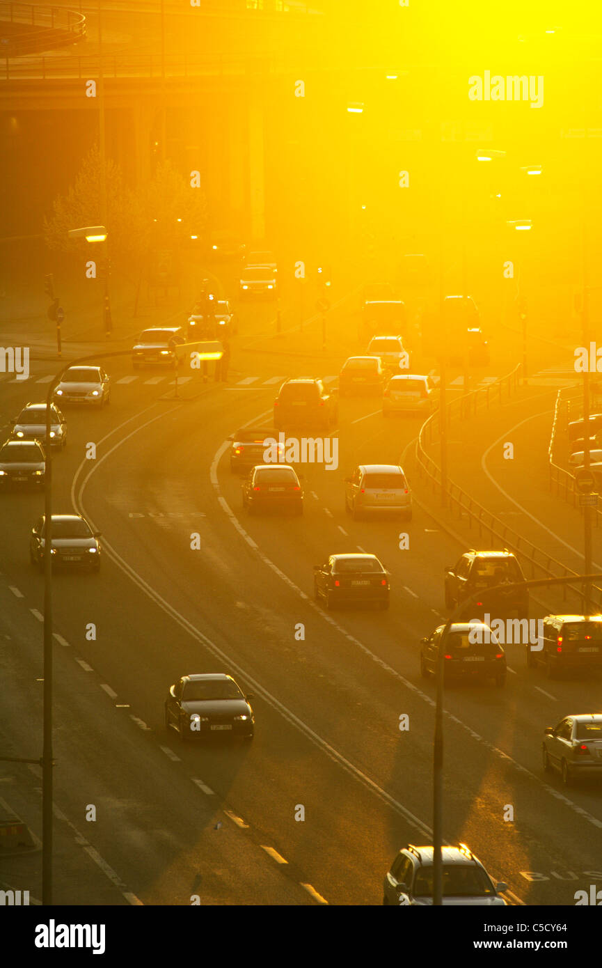 High angle view of traffic on urban road at sunset Stock Photo
