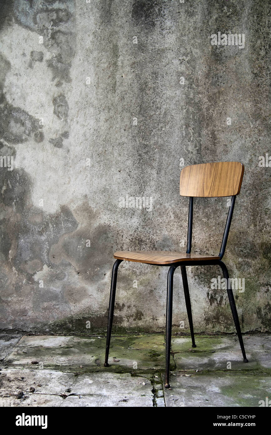 Grunge Shabby Interior With A Simple Single Chair Stock