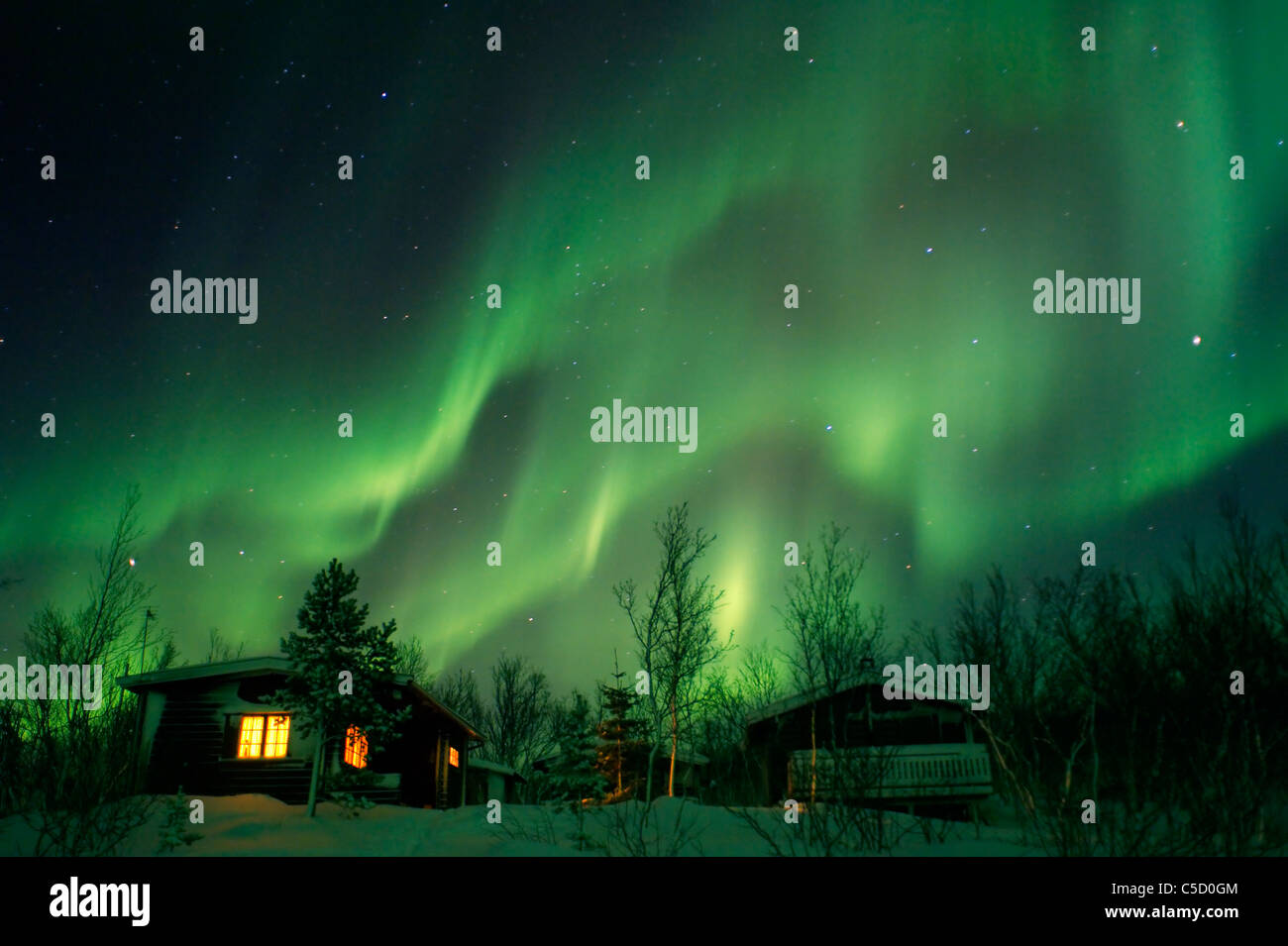 Aurora borealis over houses hi-res stock photography and images - Alamy