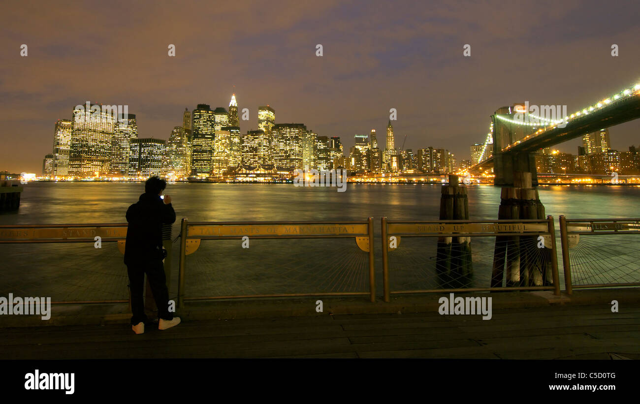 View of illuminated office blocks and high rises across the sea at Manhattan, USA Stock Photo