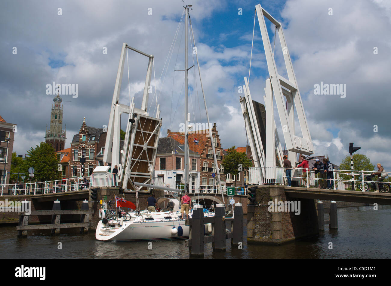 Yacht passing through elevated Gravestenenbrug bridge Haarlem town the Netherlands Europe Stock Photo
