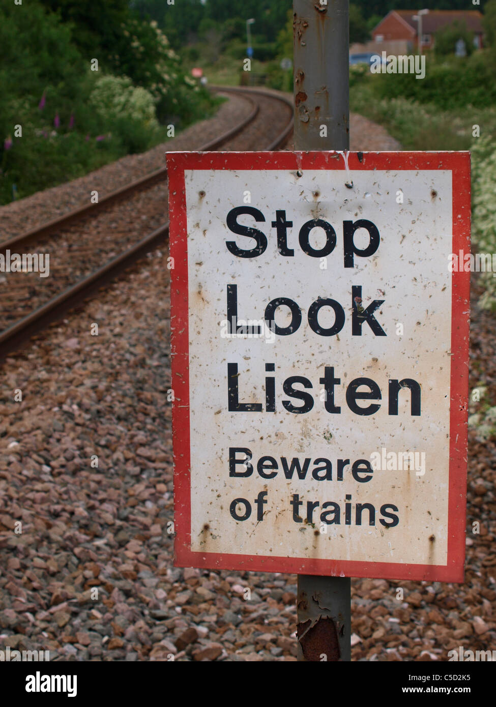 Stop, Look, Listen sign on railway crossing, Devon, UK Stock Photo