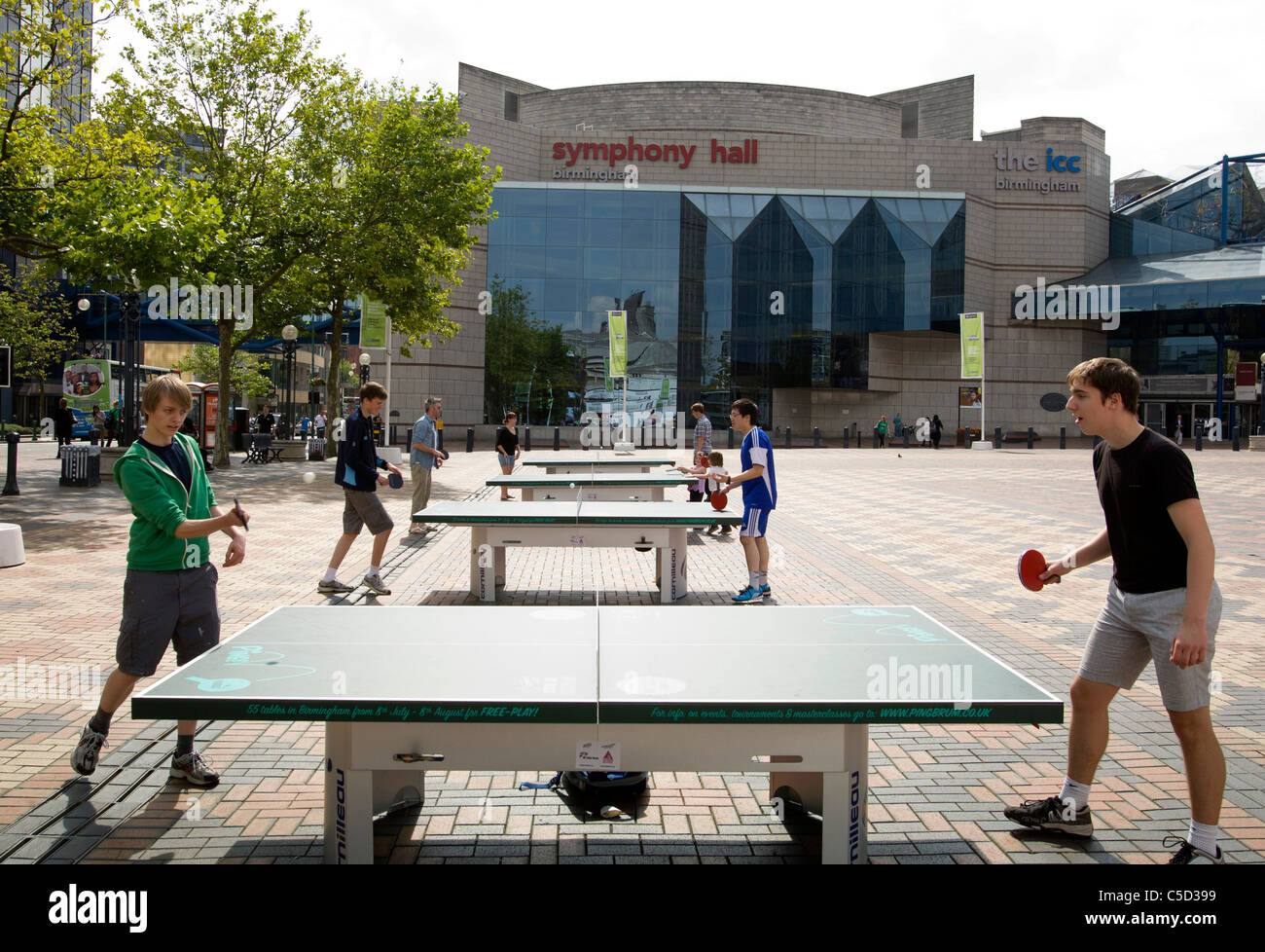 People playing ping pong in Broad Street Birmingham. Over 50 ping pong