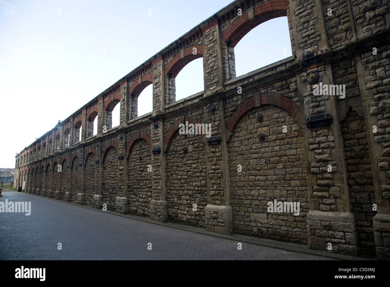 Retained wall of one of the GWR railway workshops, Swindon, England Stock Photo