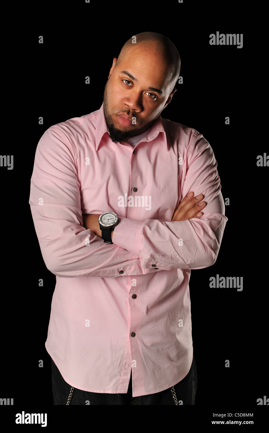 Portrait of young African American man with arms crossed isolated over ...