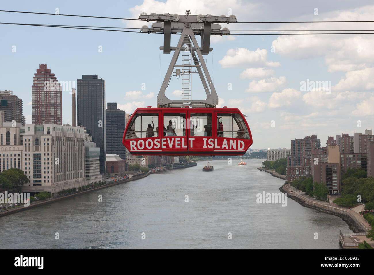 The Roosevelt Island Tram crosses over the East River headed for Manhattan in New York City. Stock Photo