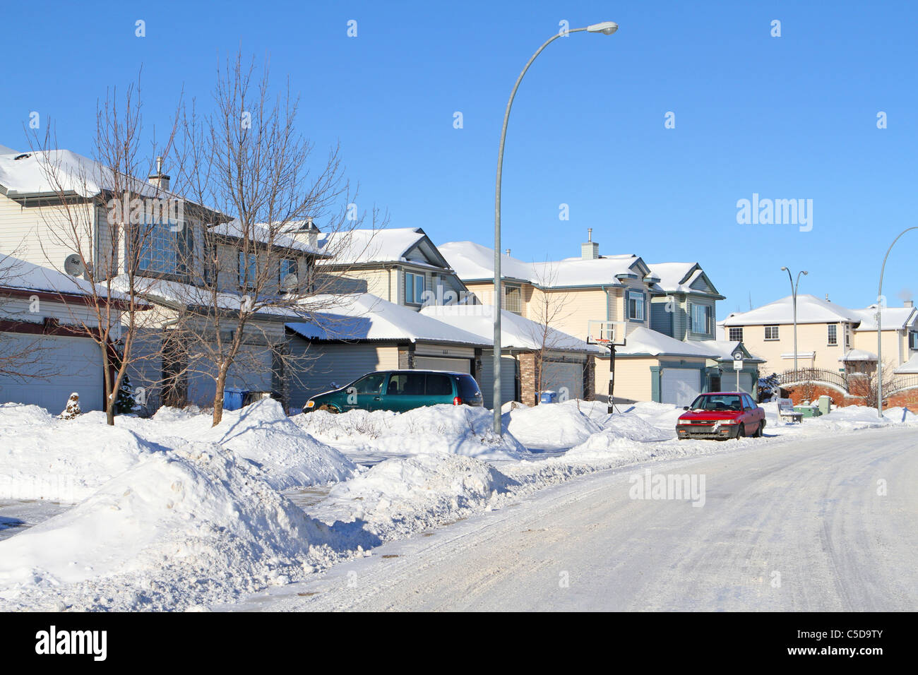 After the snowfall; Snow covered residential street in Calgary, Alberta