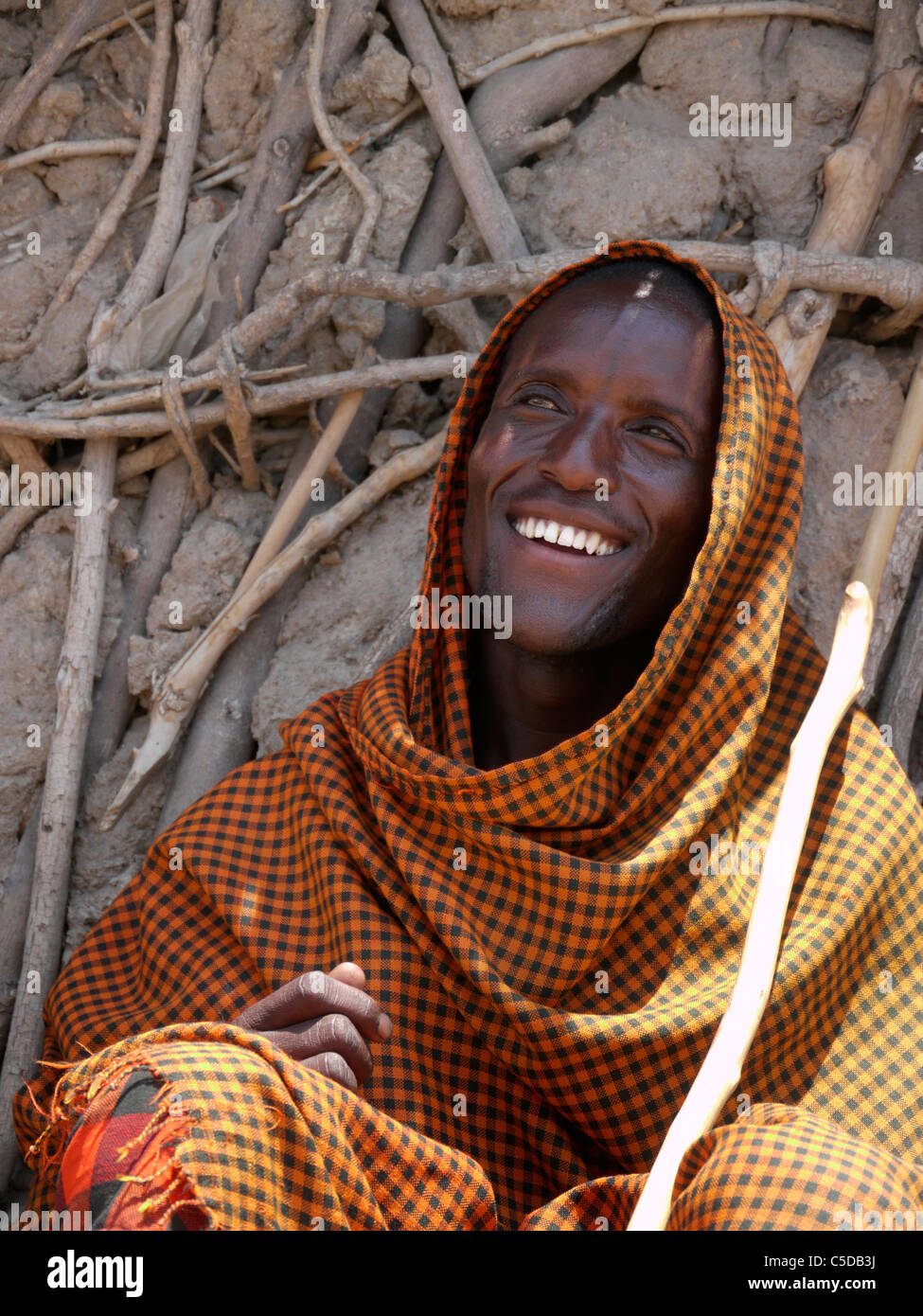 TANZANIA Watatulu tribesmen of Miyuguyu, Shinyanga district. A young man wearing blanket. photograph by Sean Sprague Stock Photo