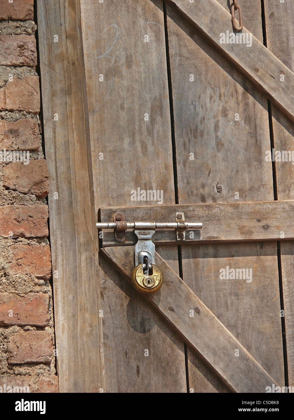 Close up of locked wooden door Stock Photo - Alamy