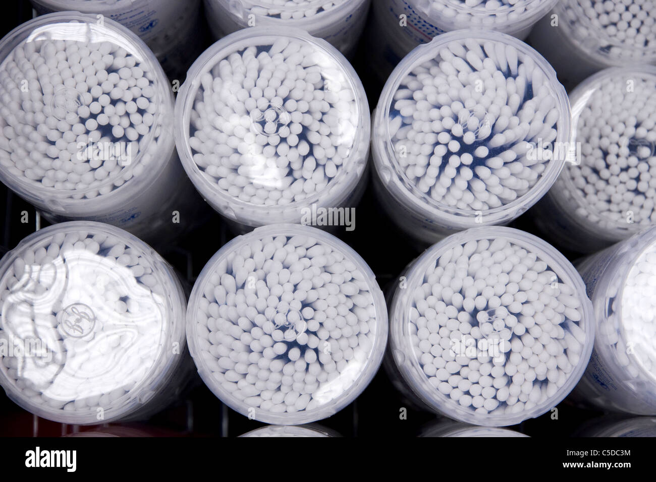 Cotton buds in plastic containers for sale in a store Stock Photo Alamy