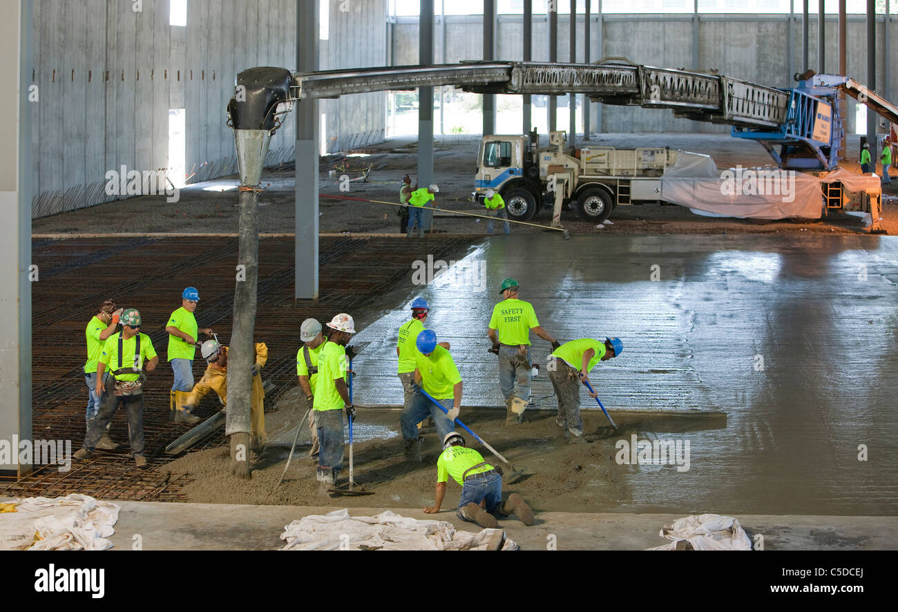 Concrete Pour over Rebar (reinforcing steel, reinforcement steel) Stock Photo