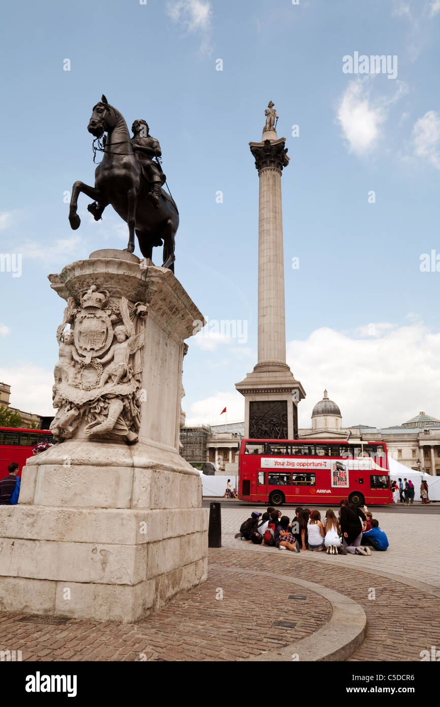 Trafalgar Square London England, with Nelsons Column and red London bus, London city centre, London,  UK Stock Photo