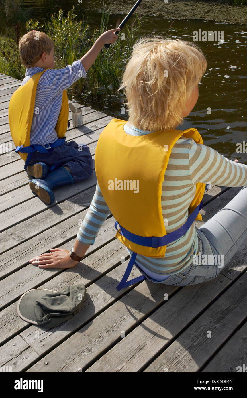 Two boys sitting fishing hi-res stock photography and images - Alamy