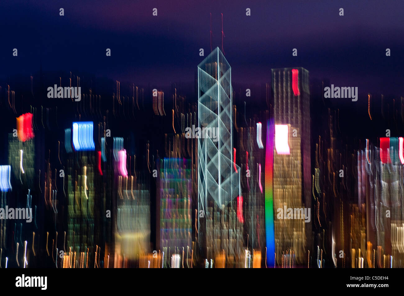 Hong Kong skyline at night with abstract blurred movement of lights Stock Photo