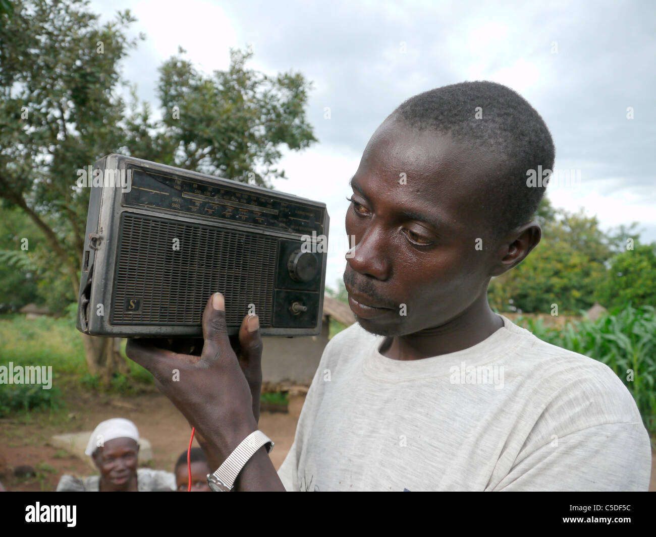 UGANDA Radio Wa series, Lira. Listening to radio Wa Stock Photo - Alamy