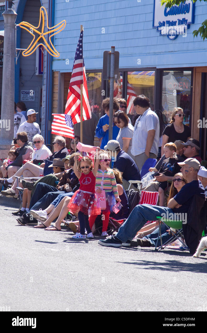 Families enjoying their small town 4th of July parade Stock Photo