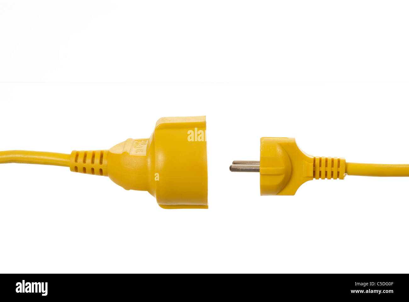 Closeup of a yellow cord and cable against white background Stock