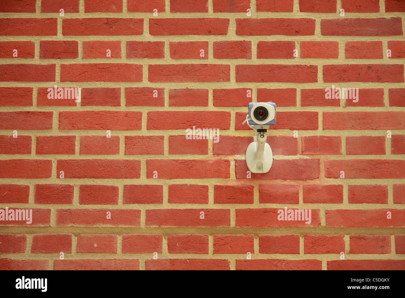Brick wall with CCTV camera Stock Photo