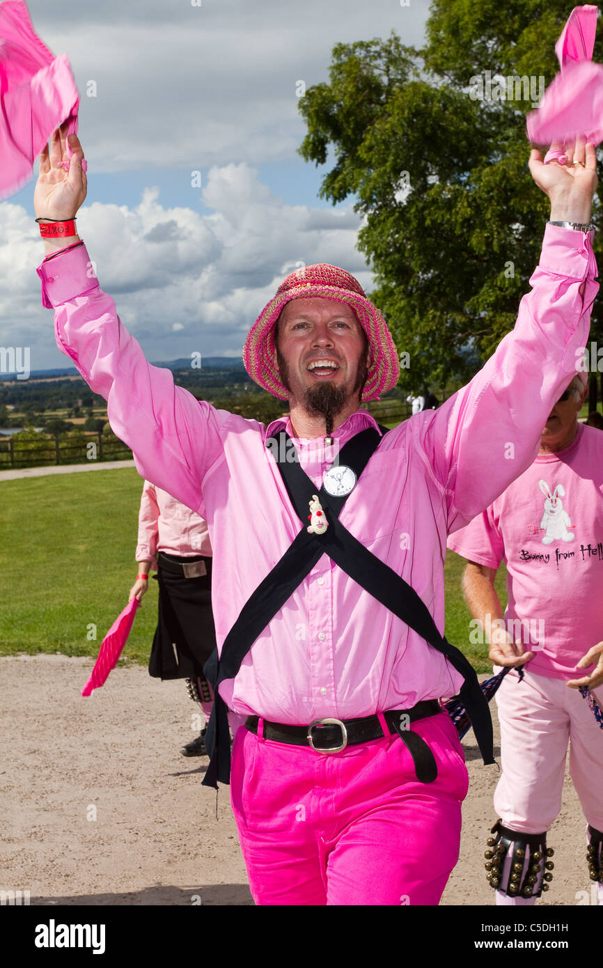 Man dressed in pink, fancy dress, Molly Morris Dancers, Detail and People, Performing at Tutbury Castle Weekend of Dance  Derbyshire, Uk Stock Photo
