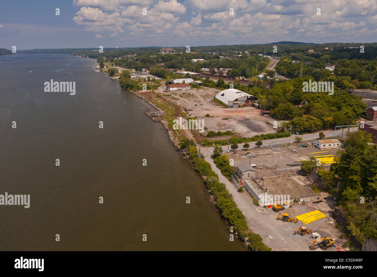POUGHKEEPSIE, NEW YORK, USA - Aerial view of brownfield, abandoned industrial land next to Hudson River. Stock Photo