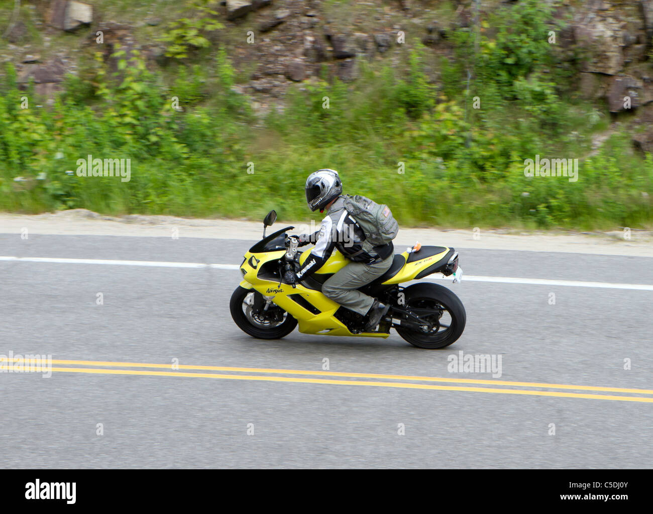 A yellow Kawasaki Ninja sport bike motorcycle on a in the White Mountains of Hampshire USA Stock Photo - Alamy