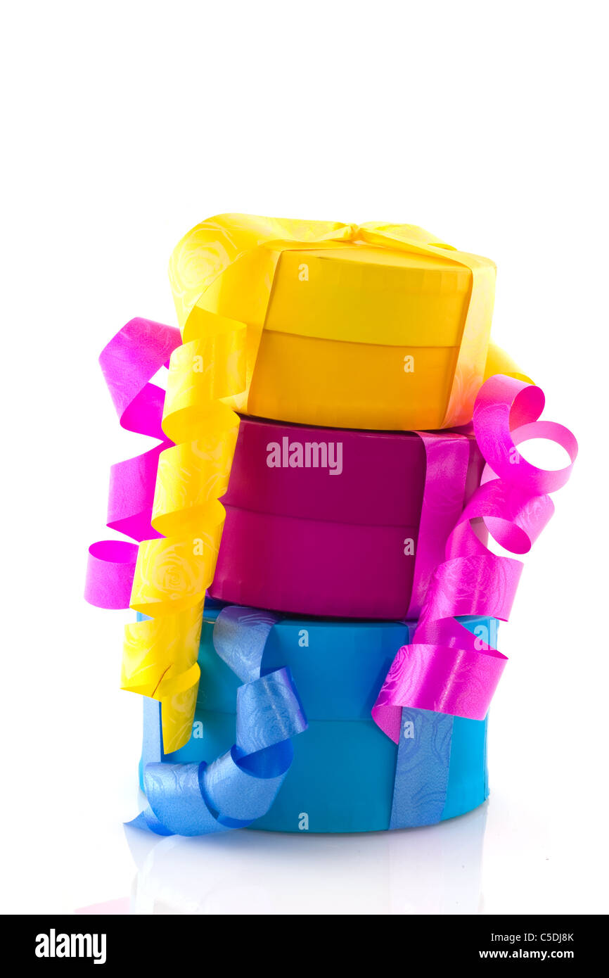 Stacked colorful birthday presents isolated over white background Stock ...