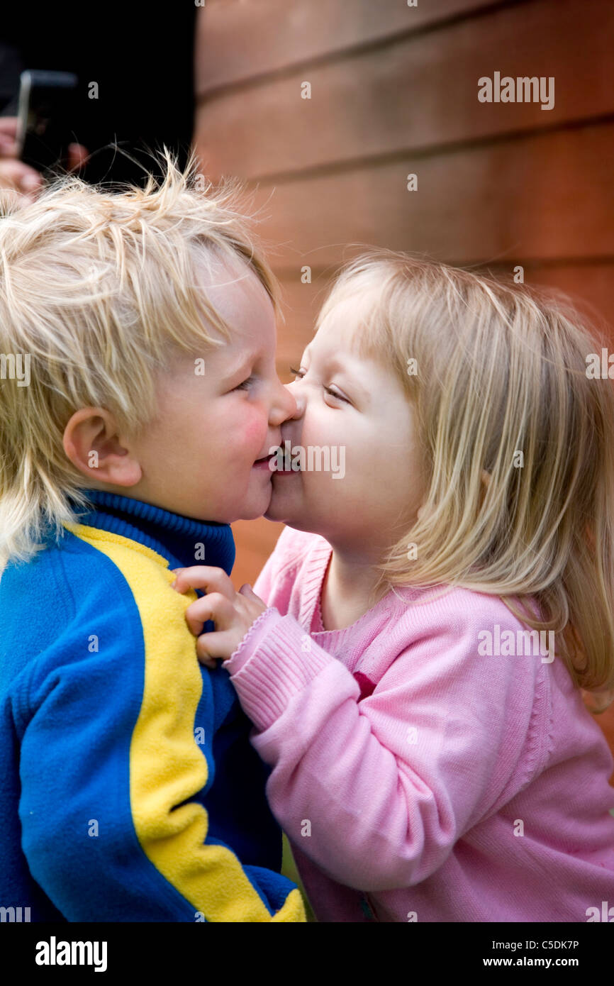 Side blond kids kissing Stock Photo Alamy