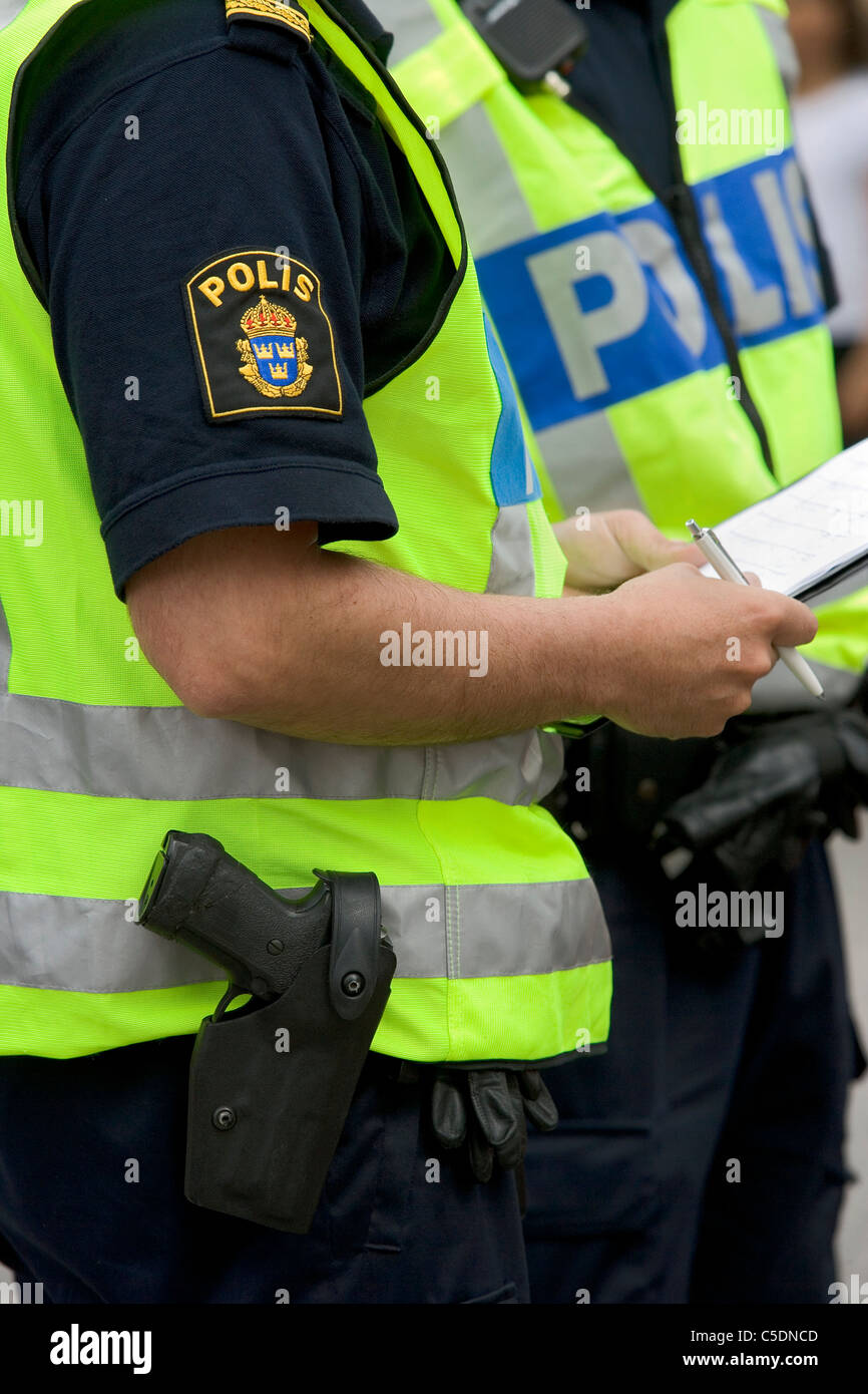 Close-up midsection of policemen with a statement Stock Photo