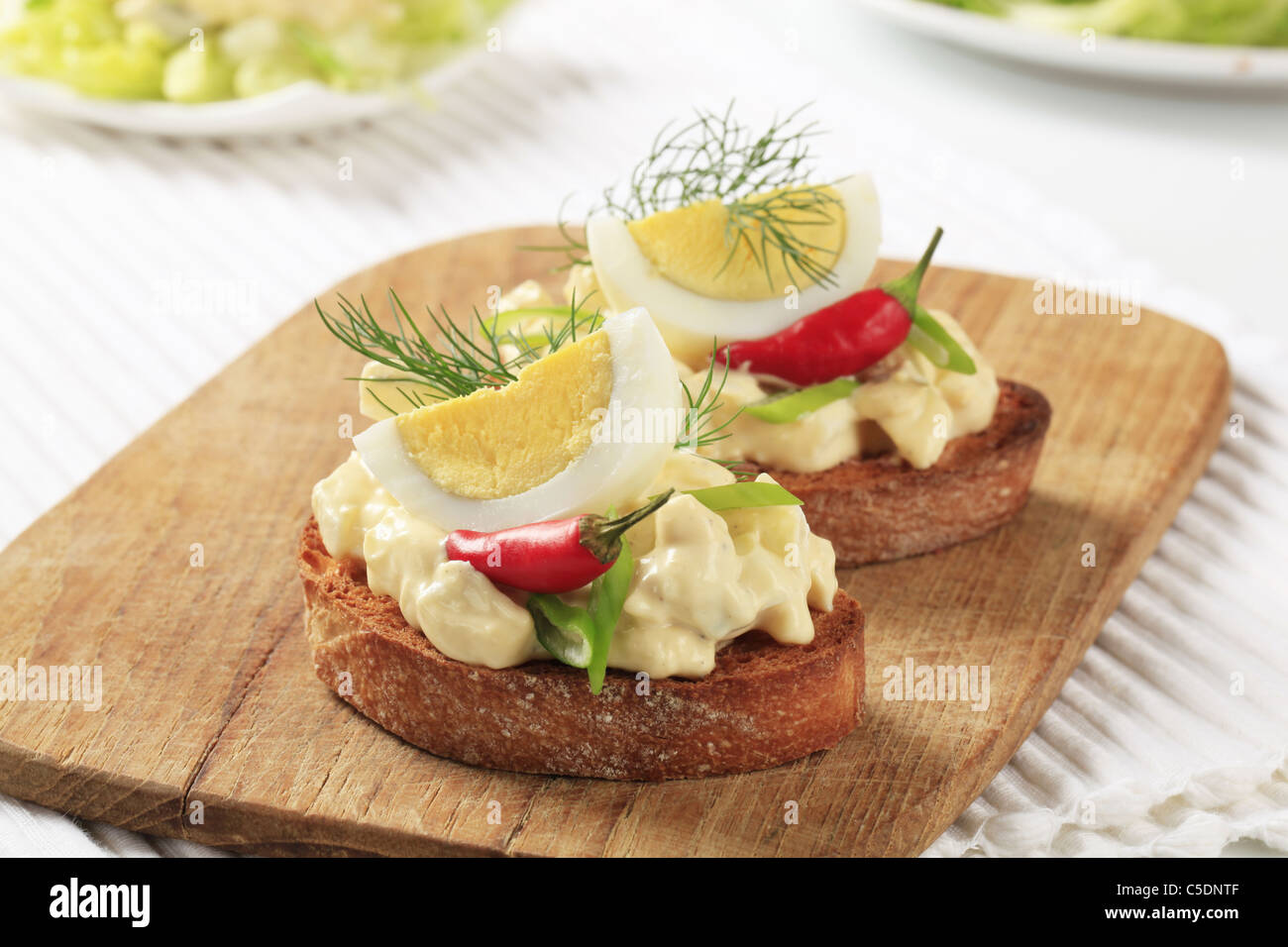 Slices of crispy toasted bread and egg spread Stock Photo - Alamy