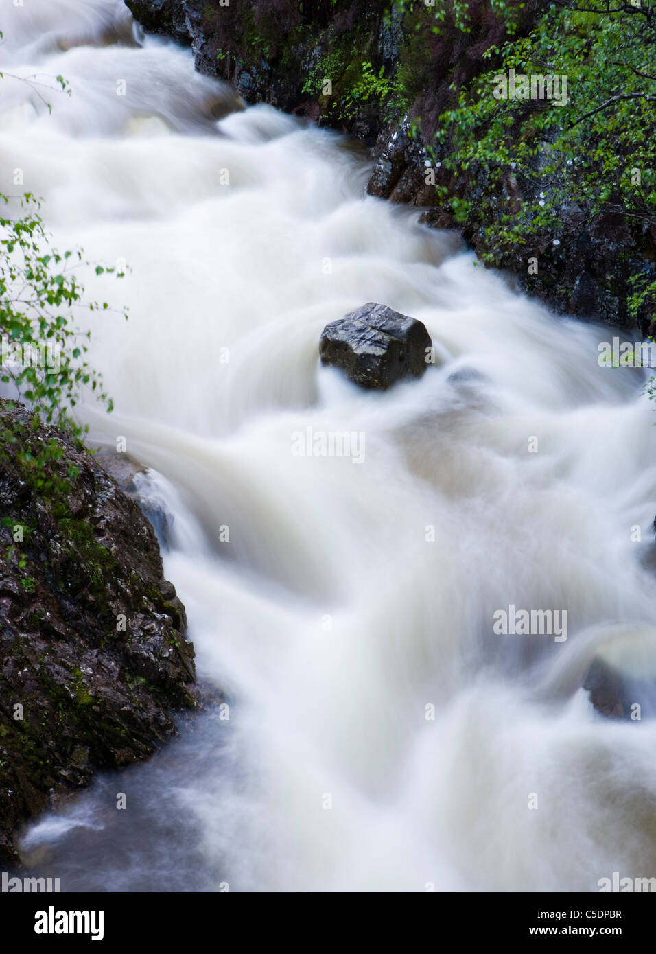 Rock and flowing water. River Coupall, Glencoe, Highland, Scotland, UK. Stock Photo