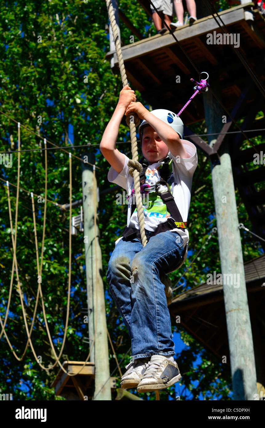 Boy on a rope slide Stock Photo Alamy