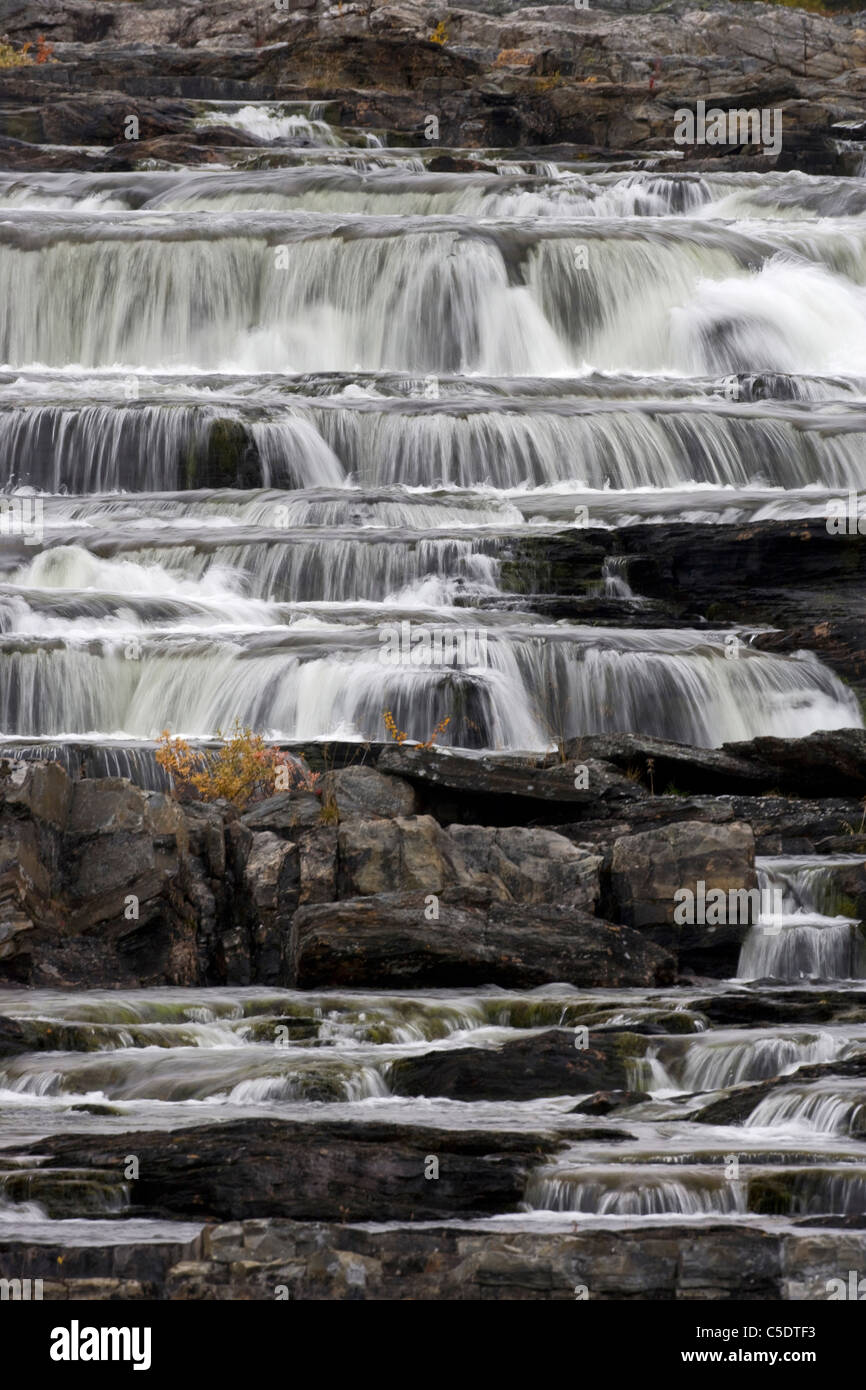 Low angle view of rushing water through rock stairs in Lapland, Sweden Stock Photo