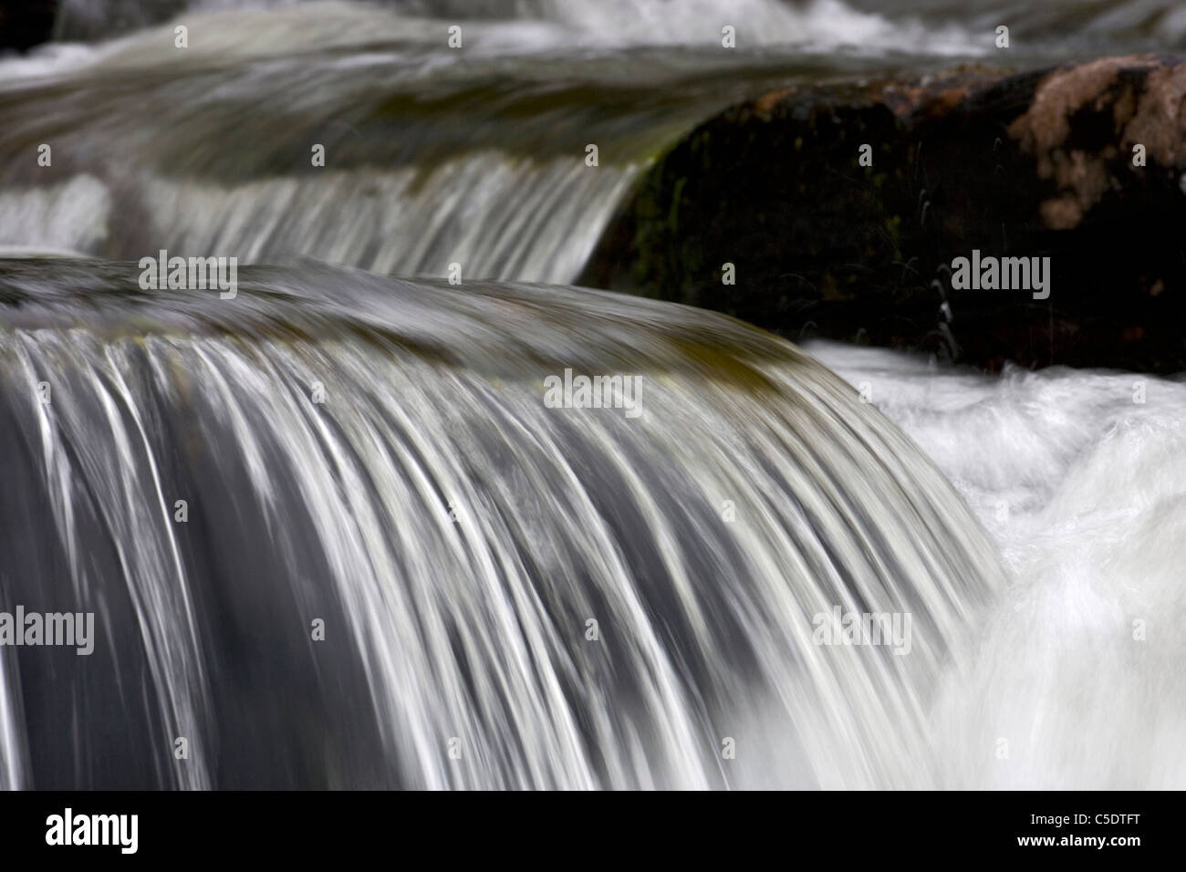 Detail shot of rushing water in stream Stock Photo