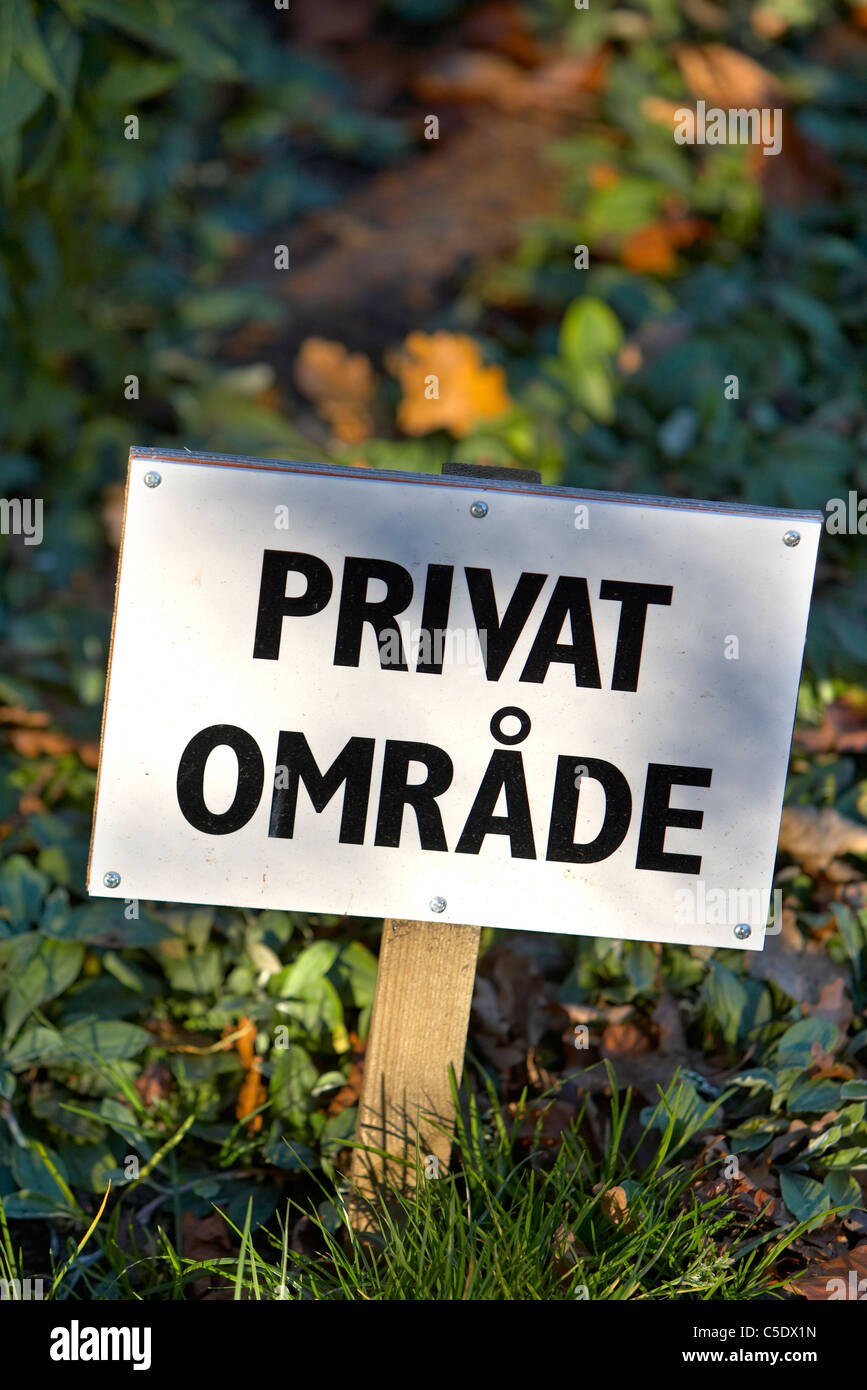 Close-up of a private area signpost against blurred plants Stock Photo
