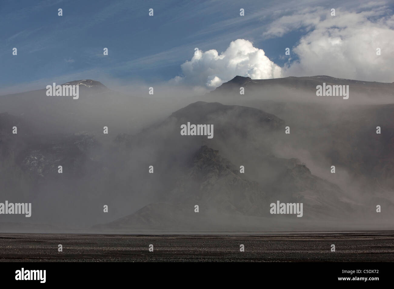 Remote landscape with eruption area of Eyjafjallajokull volcano in the background at Iceland Stock Photo