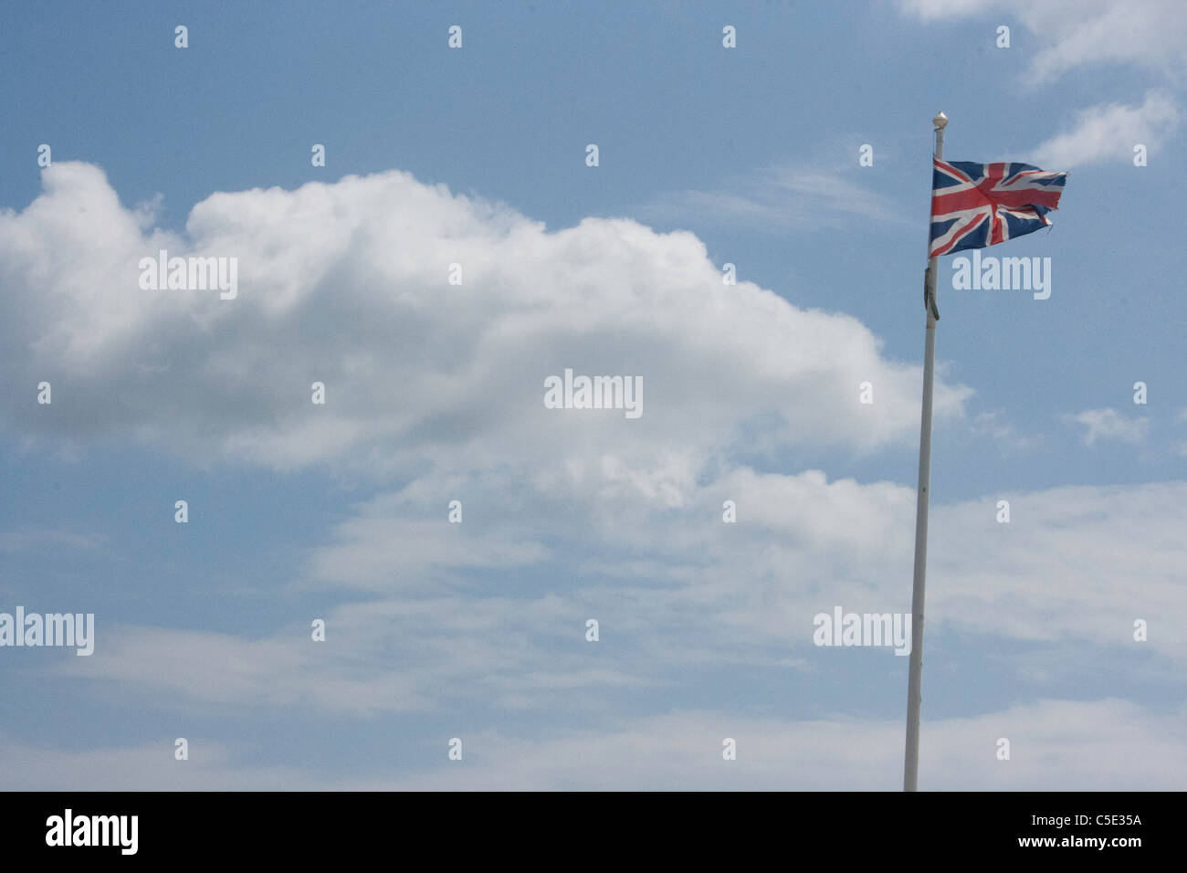 Union jack against a cloudy sky Stock Photo - Alamy