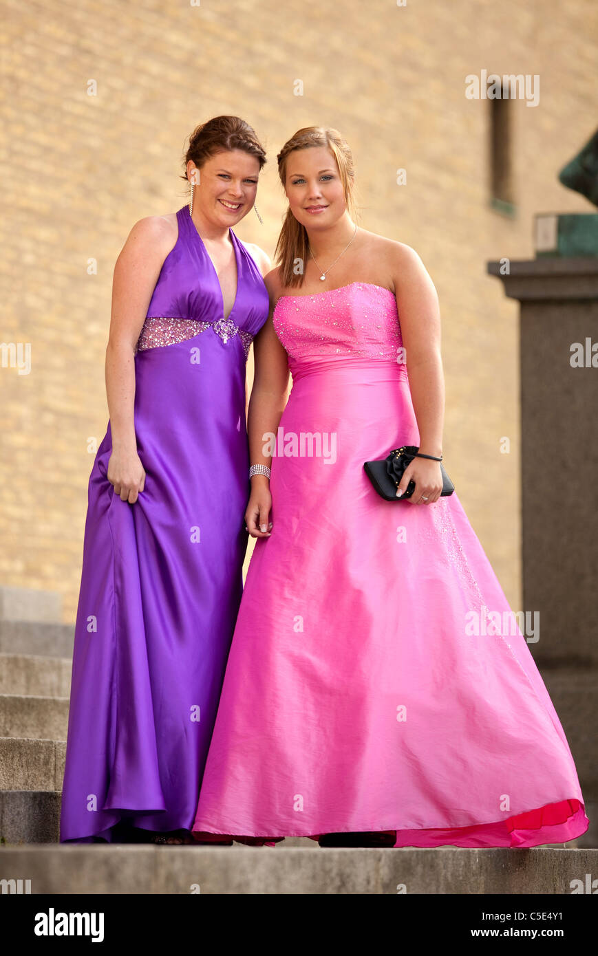 Full length portrait of two teenage girls in ball gowns Stock Photo - Alamy