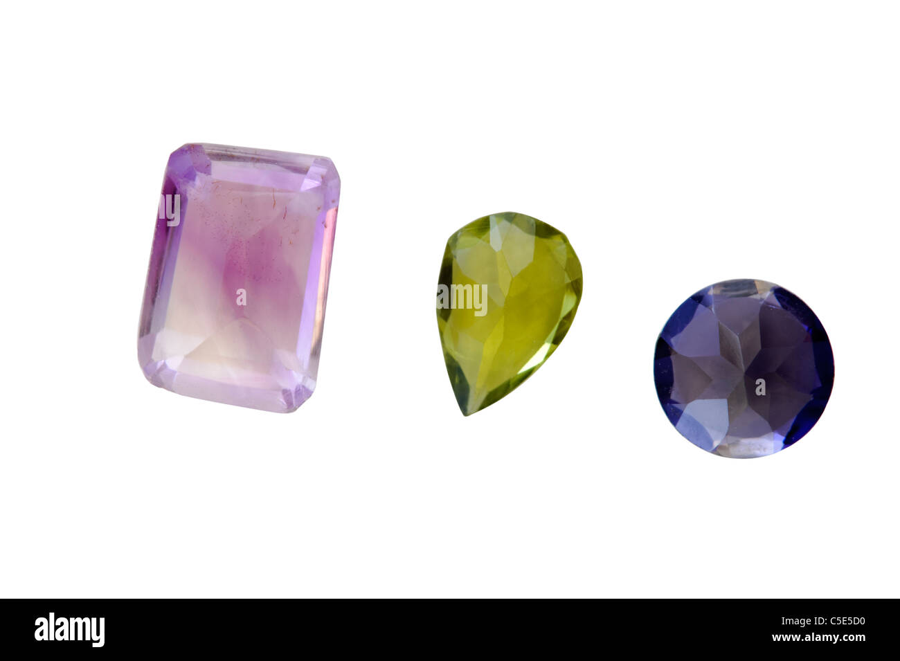 Three semi-precious gemstones Amethyst from Brazil, Green Peridot from Ethiopia and Blue Iolite from India Stock Photo