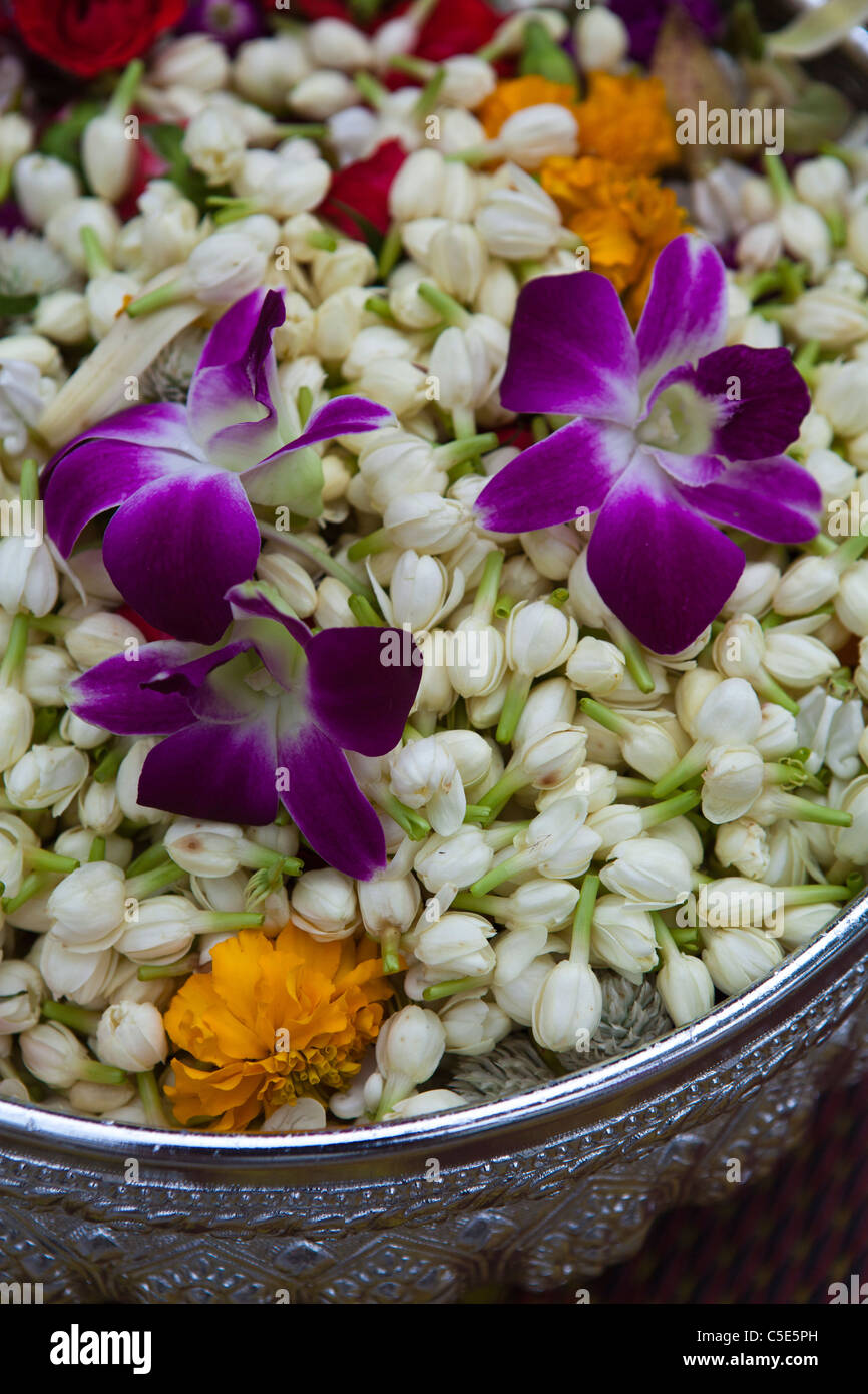 To mark the beginning of Buddhist Lent, many temples organize offerings flowers to monks in Thailand. Stock Photo